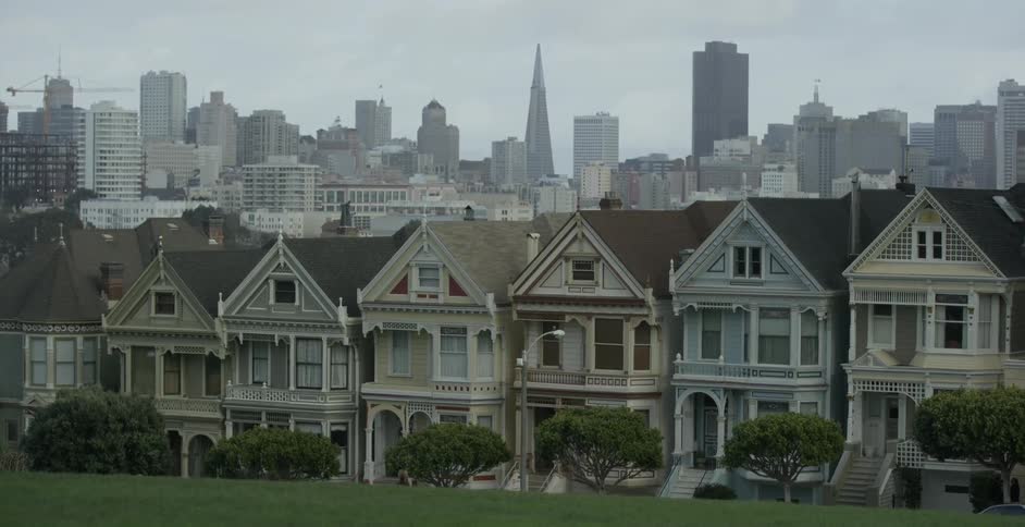 The street is on a hill and covered with houses