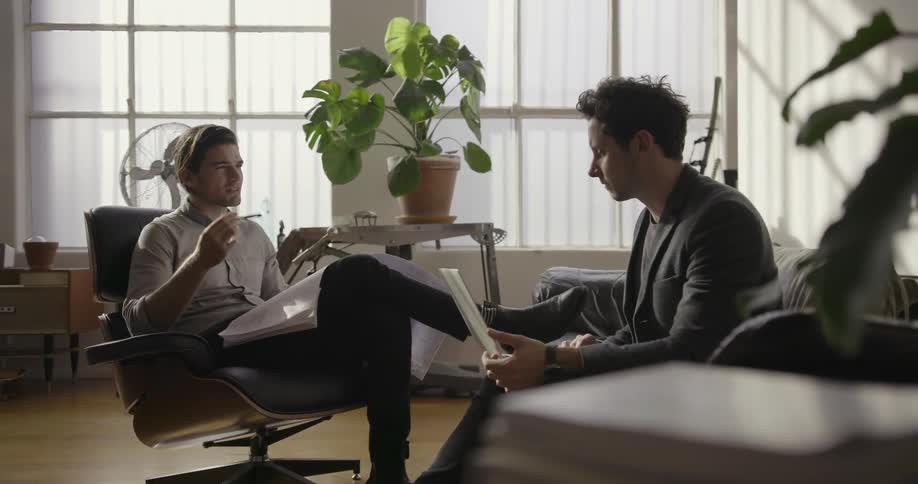 Two men talking in an office