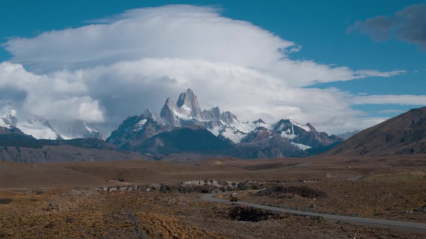 A mountain under building clouds