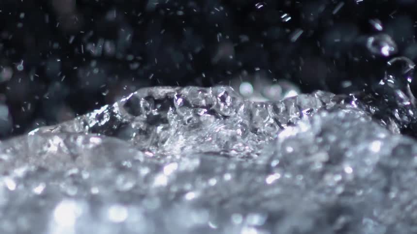 Water is bubbling and splashing really close to the camera