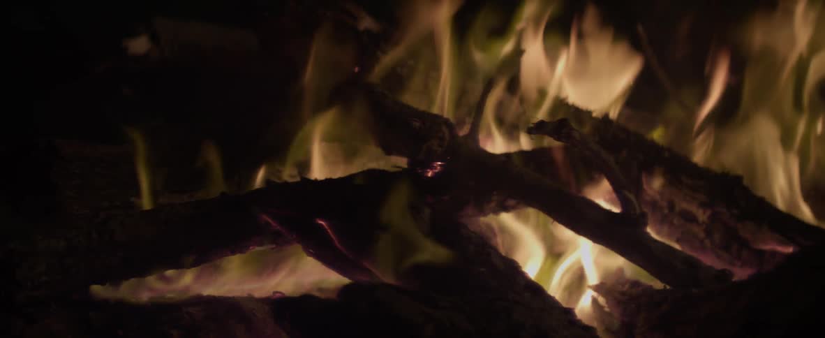 A campfire burning at night