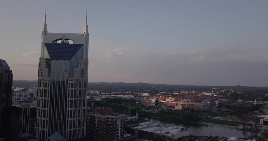 A tall tower hovers above the city