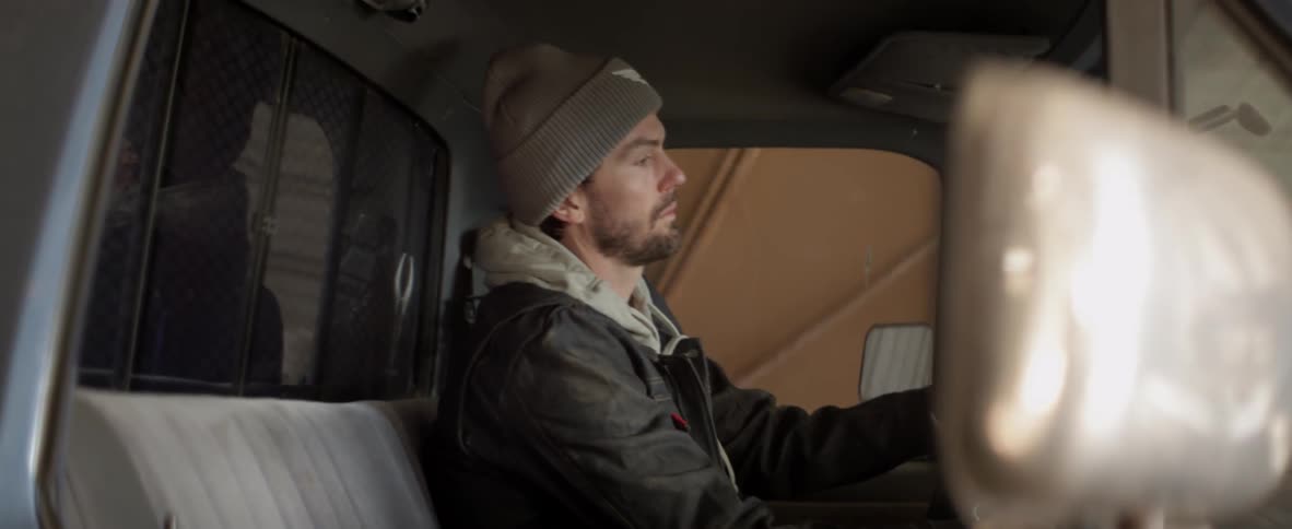 A man enters his truck