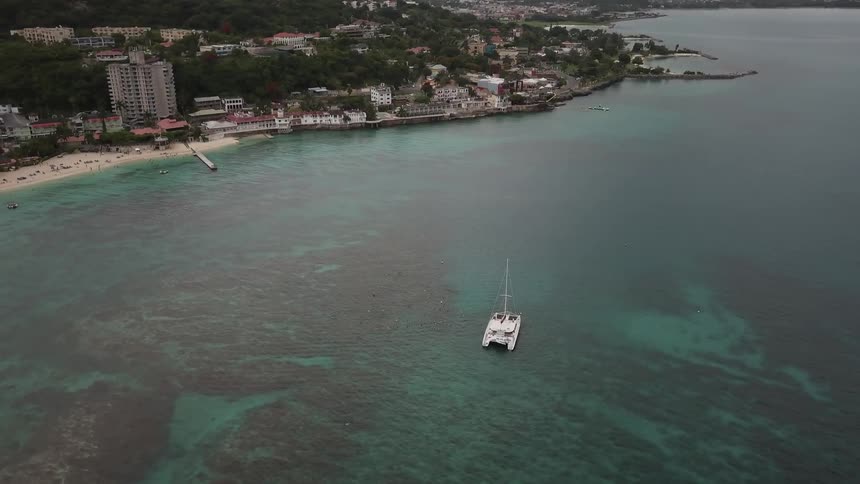 A boat is still in the water outside the town