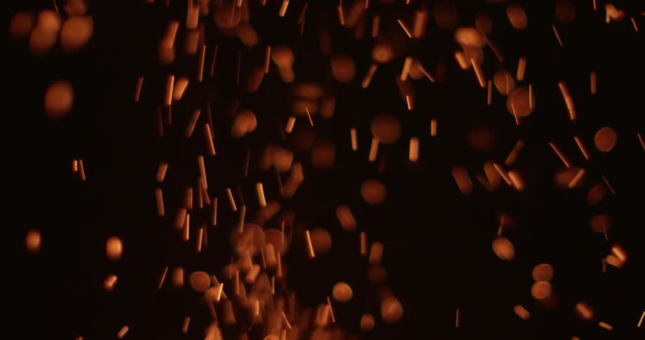 Sparks fly from a campfire
