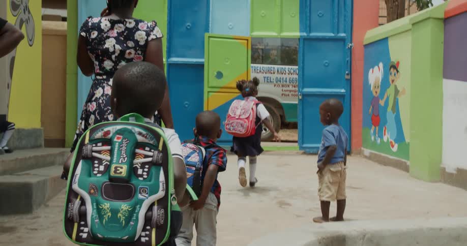 Young school children are exiting the school