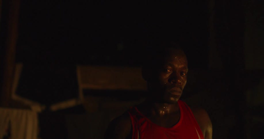 Angry looking man in dim light