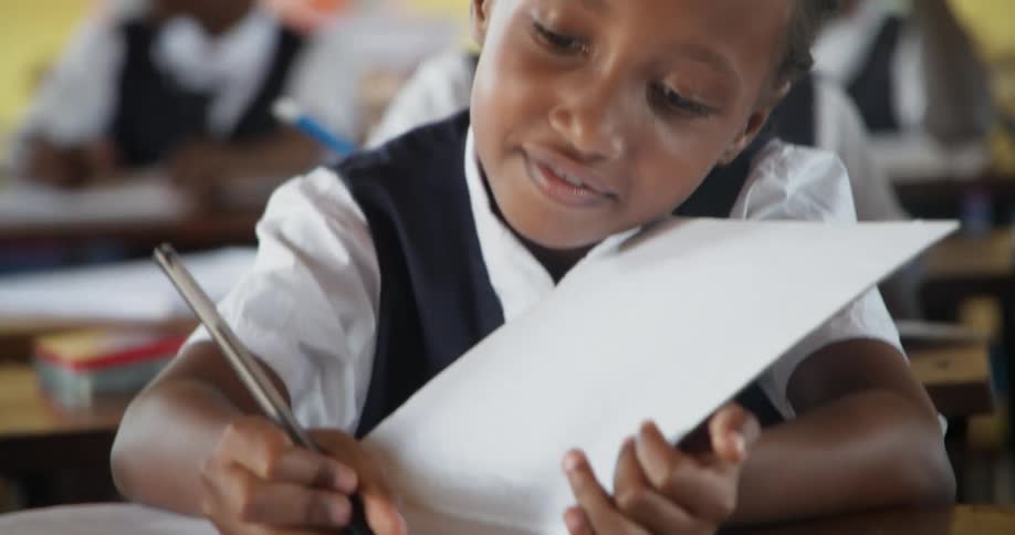 Children working on school work in class