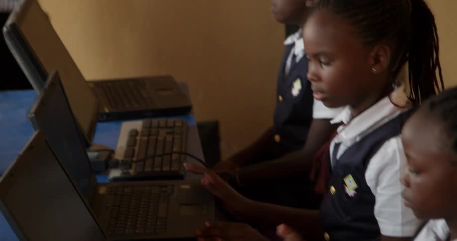 Students work on computers in a classroom