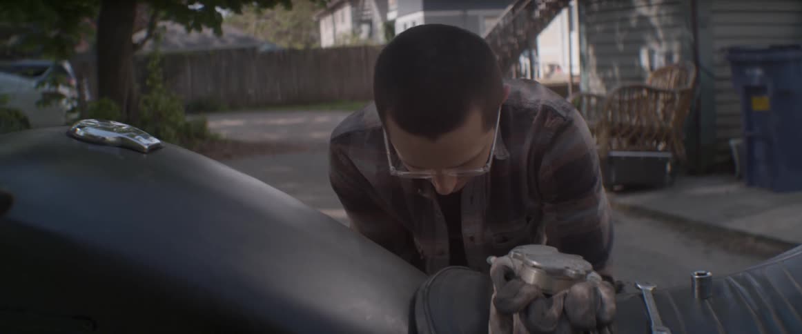 A man is working on a motorcycle