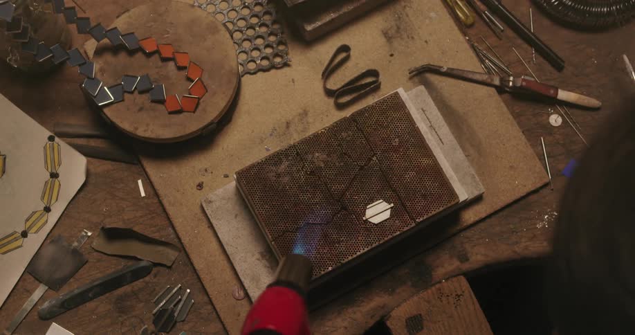 Someone is taking a torch to a piece of metal