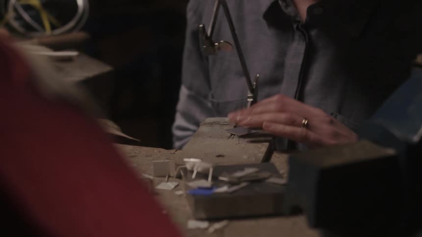A man sits down to begin working