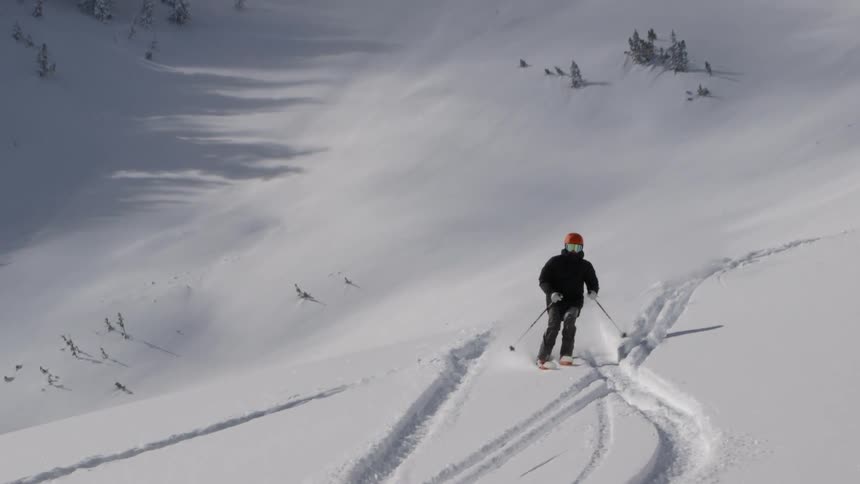 A person skiing past the turn