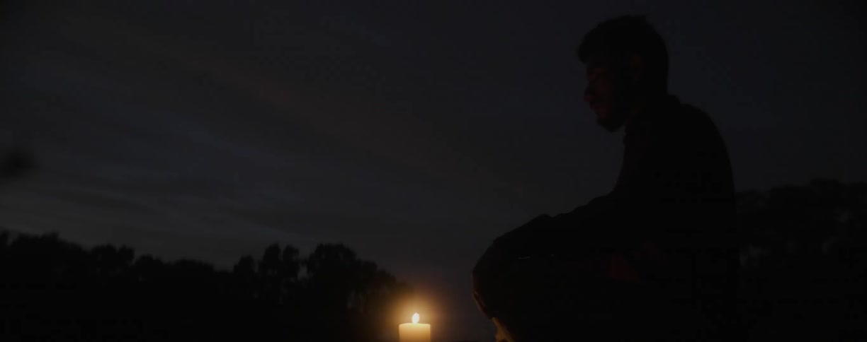 Candle burning in the dark