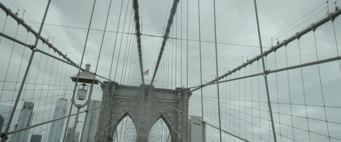 A suspension bridge is being filmed