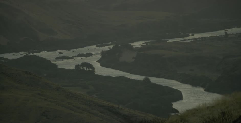 View of a river flowing through hills