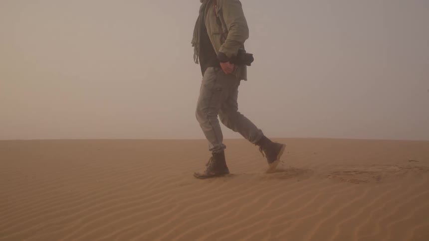 Someone walking through the desert