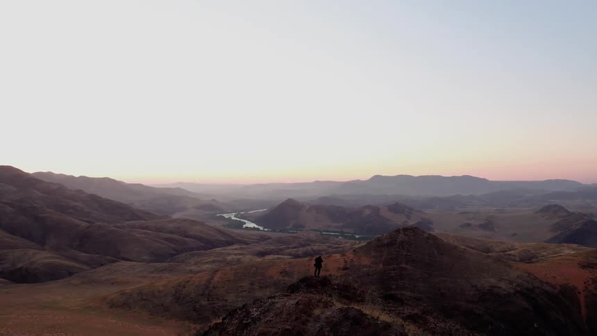 A person is hiking on the mountains