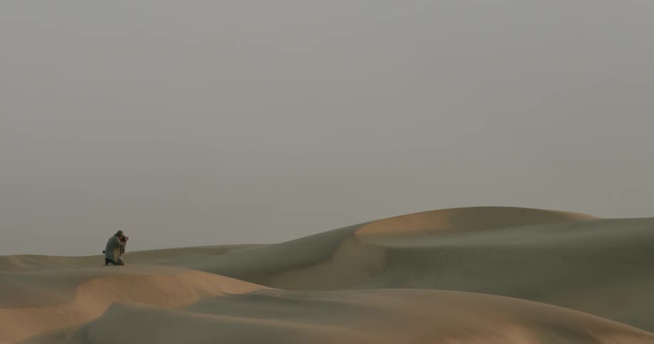 Someone is taking pictures of the vast desert