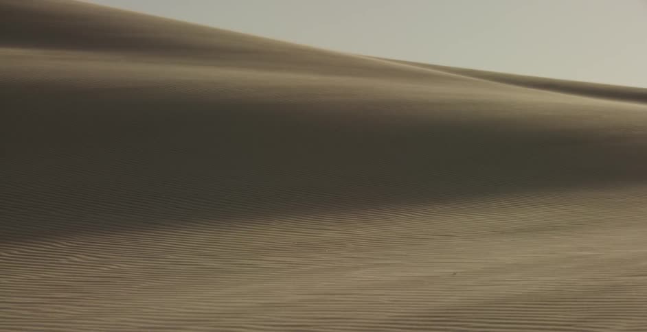 Wind kicking up the sand in the desert