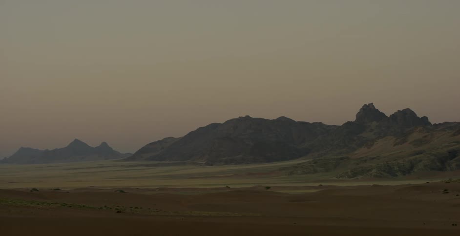 Mountains are shown at sunset