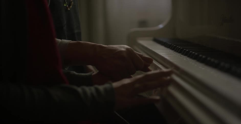A person begins to play the piano