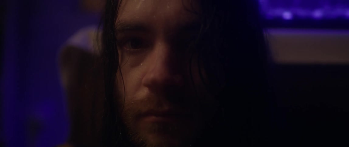 A man quickly opens his eyes