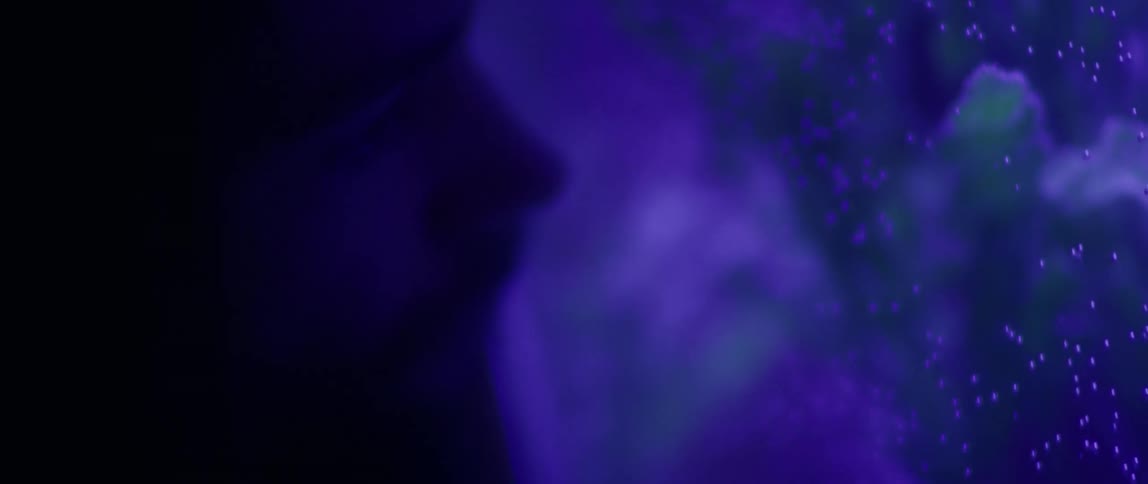 A man is looking into an aquarium