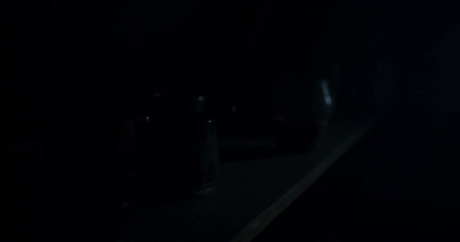 Lighting flashes are illuminating a shelf with cups on it