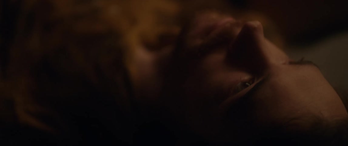 A man looks around while laying down