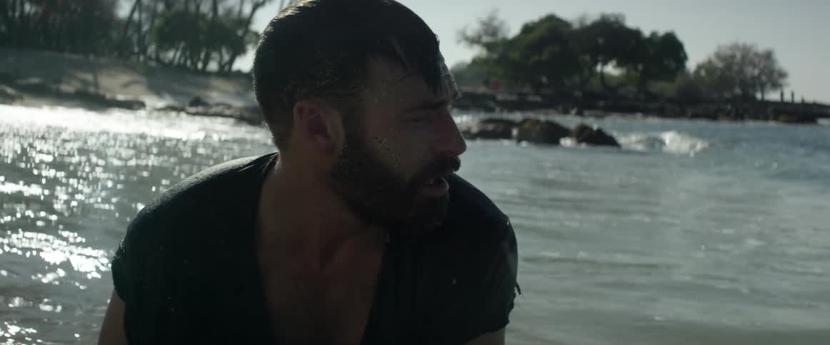 Man looking confused as he looks around on a beach