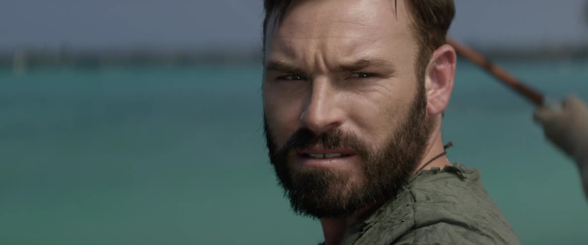 A man frowns looking over his shoulder