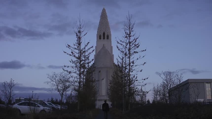 A man walks towards the cathedral