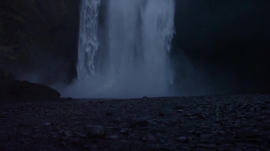 A waterfall at night