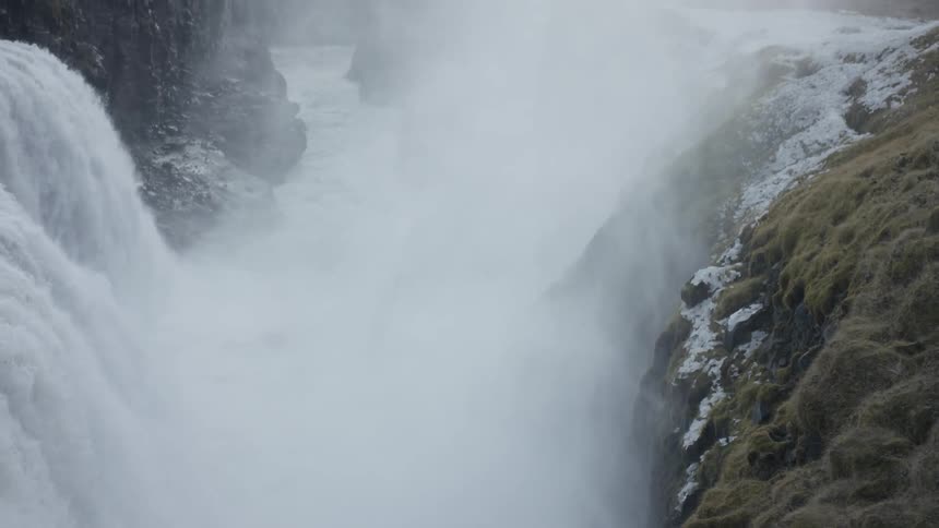 A waterfall rolling down a cliff side