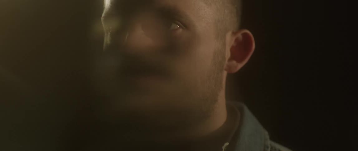 Lights flash around a man's head