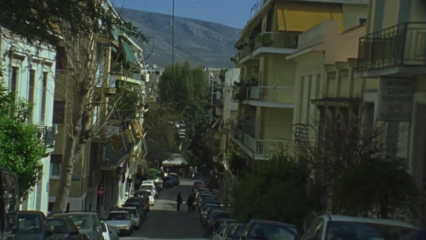 A car passes at the end of a road