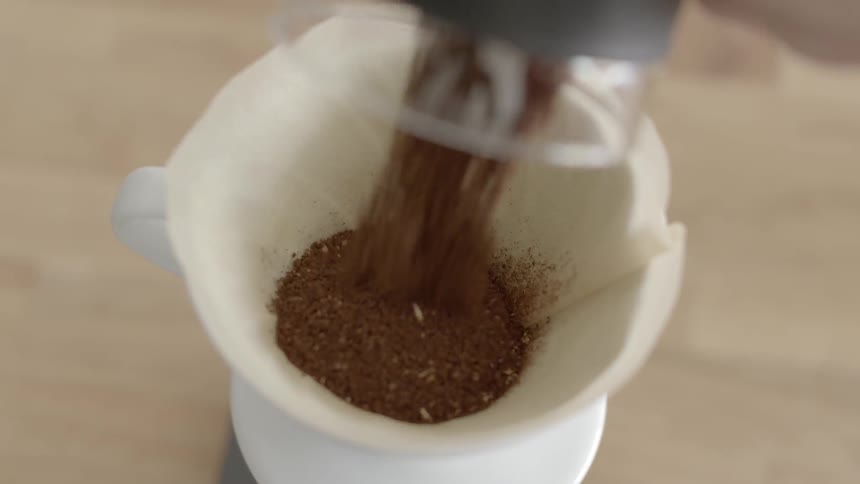 Spices are poured into a container