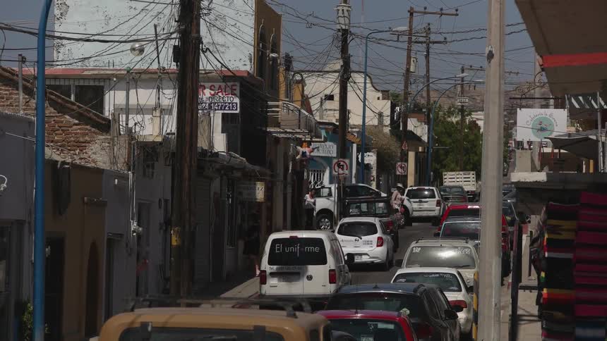 Vehicles travel down a city road