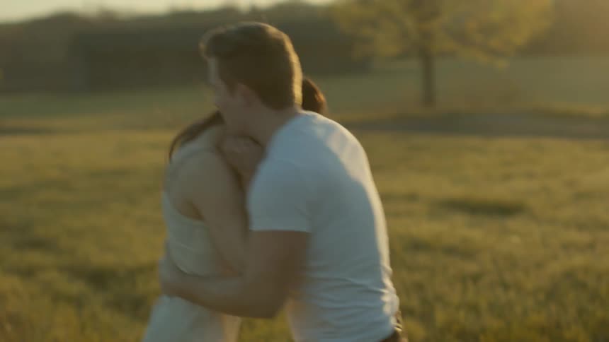 A man and woman fight on a field