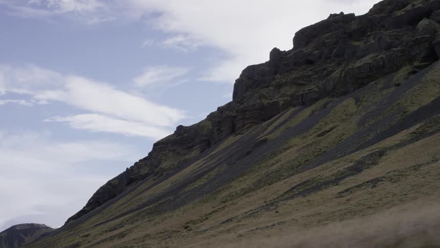 A mountain looms high into the sky