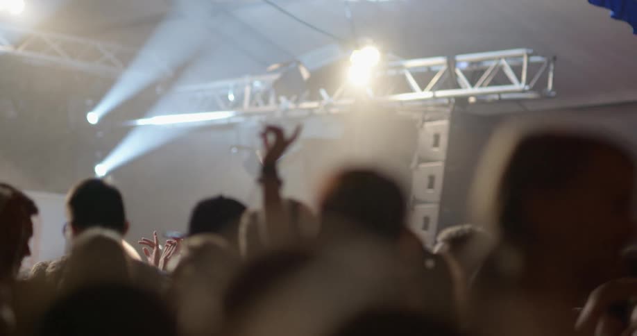 People dance clap in a dance club