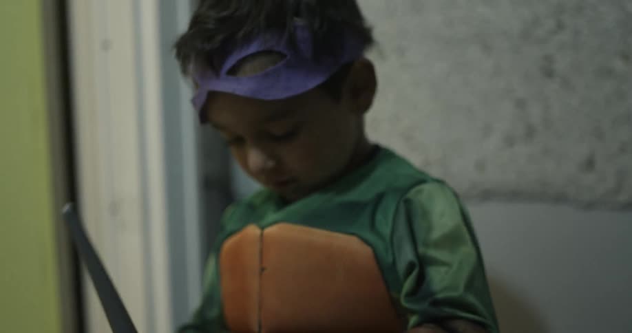 Young boy collecting candy for halloween