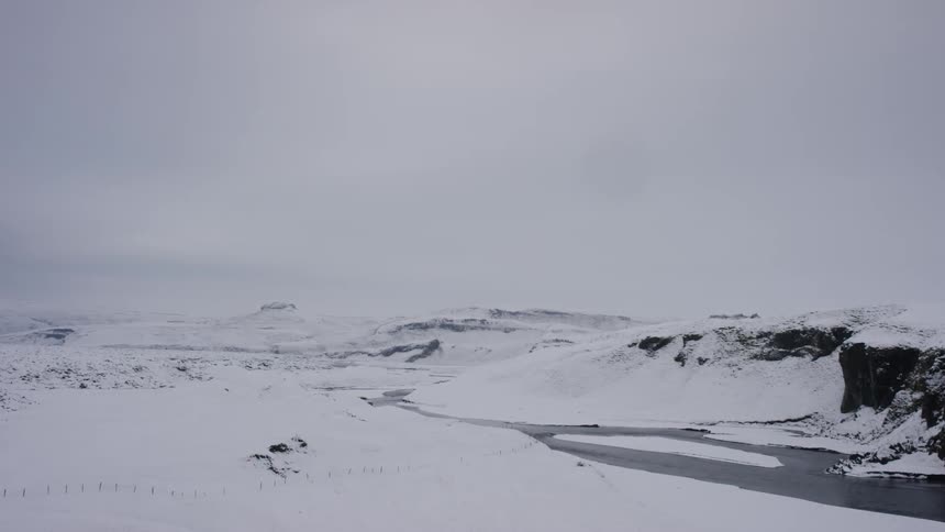 Vast open lands and mountains covered with snow
