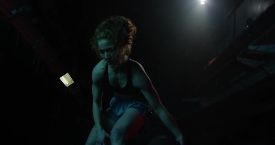Close up video of a woman dribbling a basketball