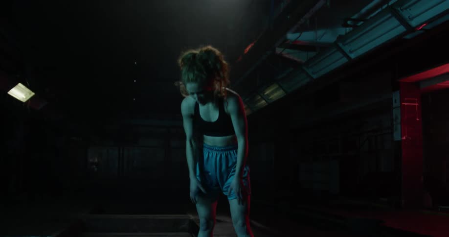 A woman stretches and catches her breath