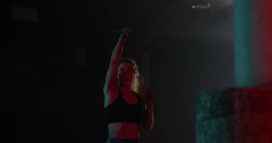 A woman shoots a basketball