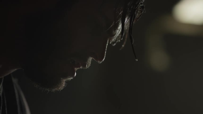 A man is dripping with sweat