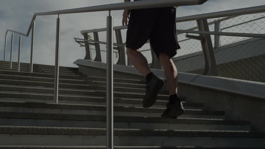 A man runs up and down steps