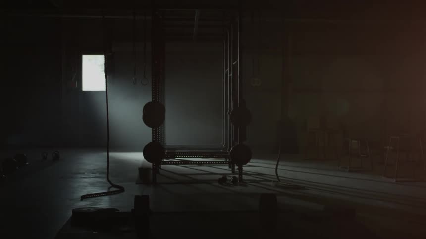 A door opens into a gym